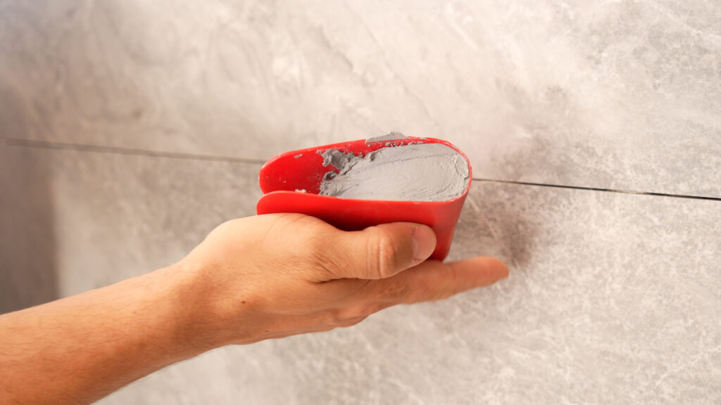 62977_ESPÁTULA_APLICADORA_PARA_REJUNTE_AMBIENTADA